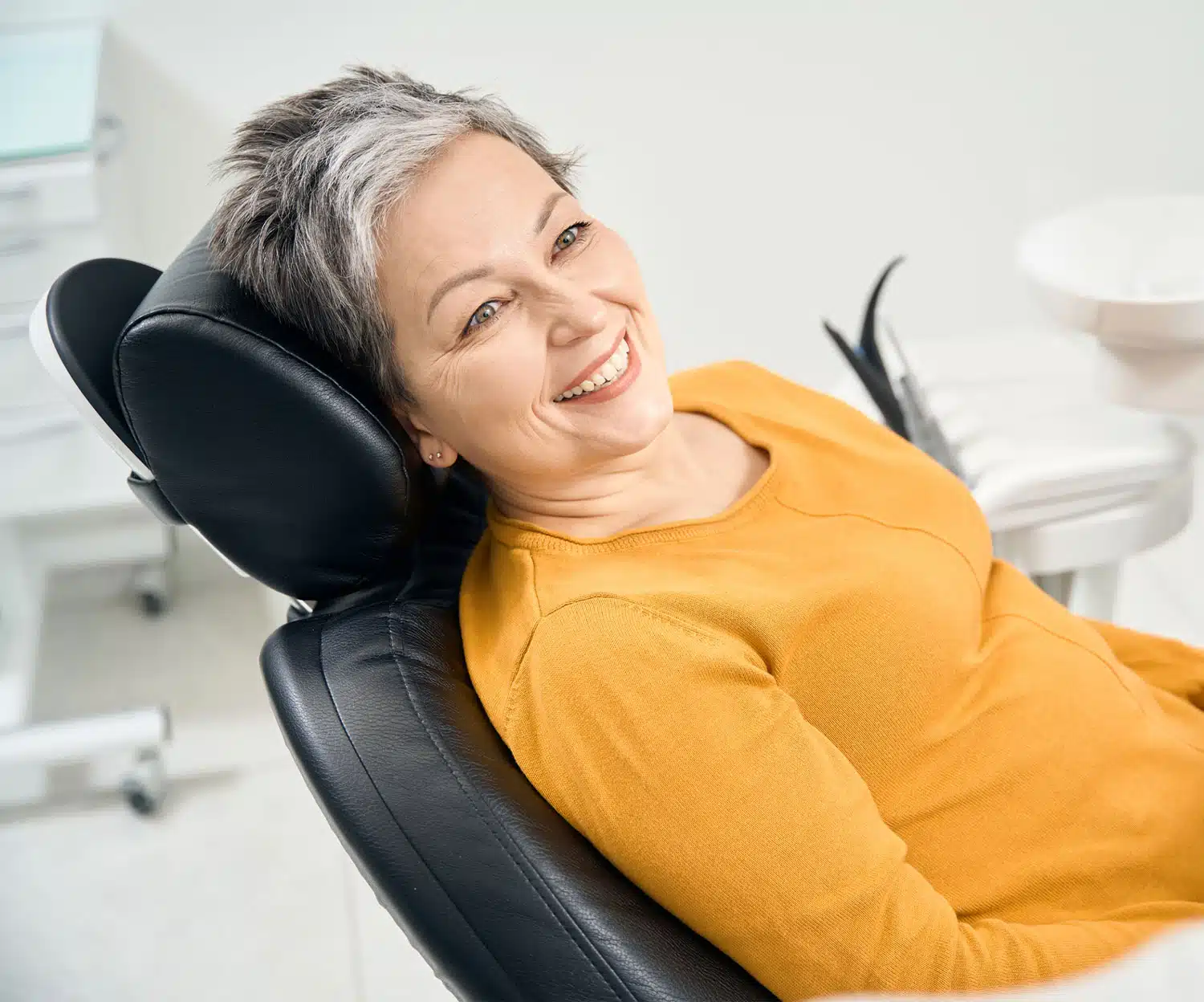 Patient smiling sitting in an dentist chair