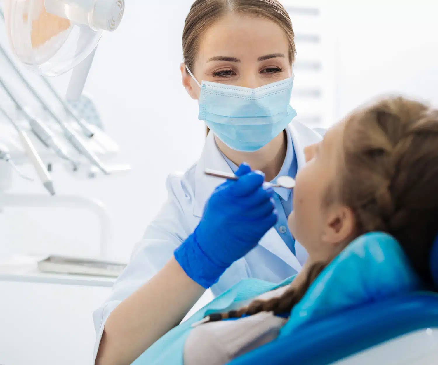 Happy dentist doing procedure in a patient