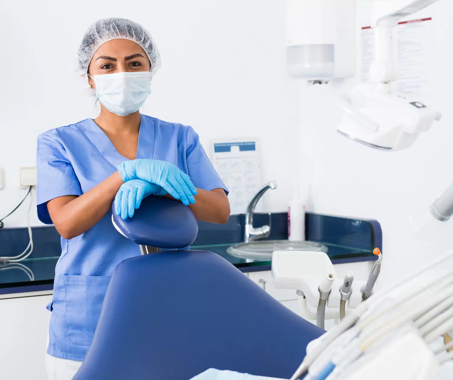 Dentist posing for the picture in her office