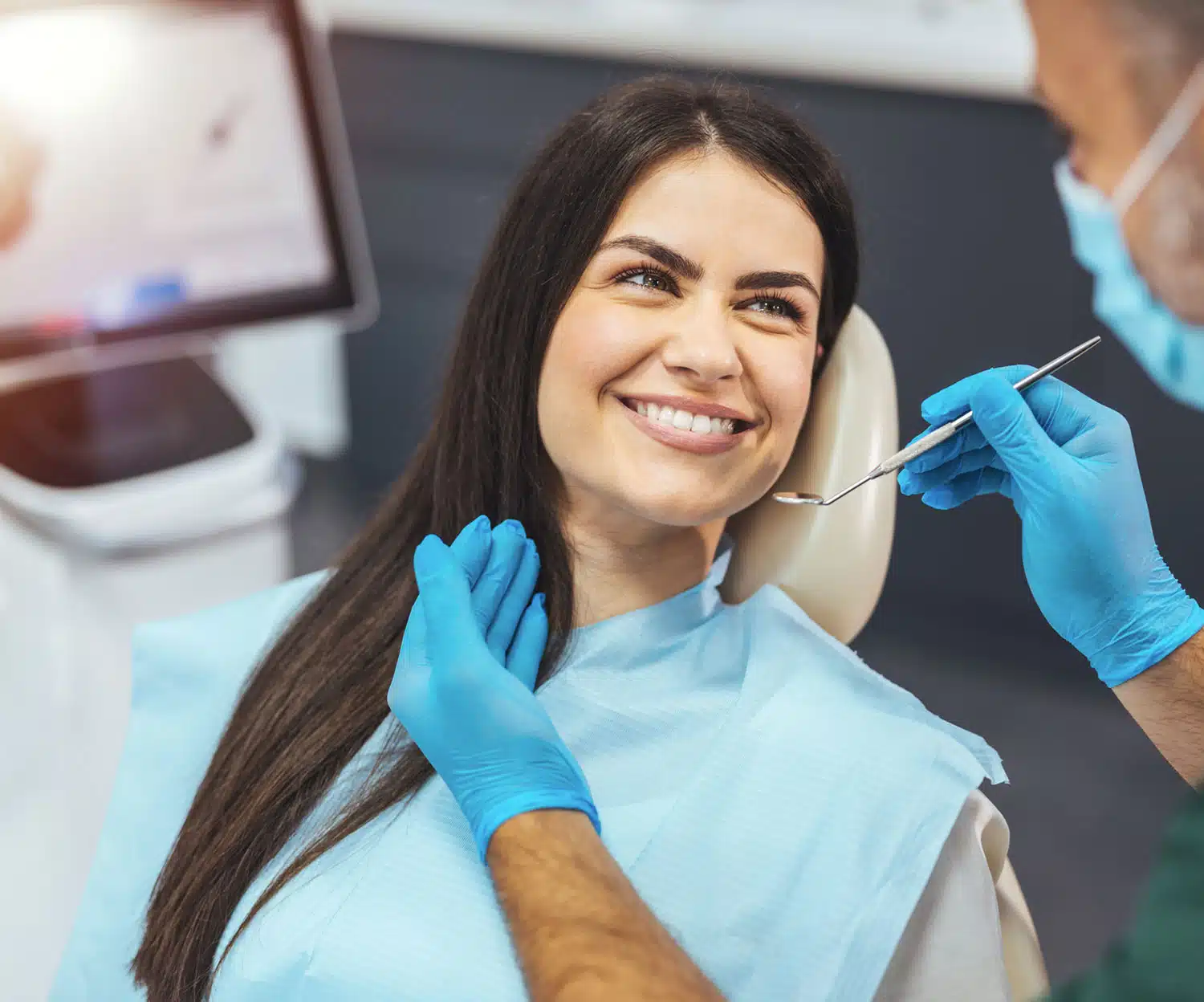 Woman smiling to the dentist