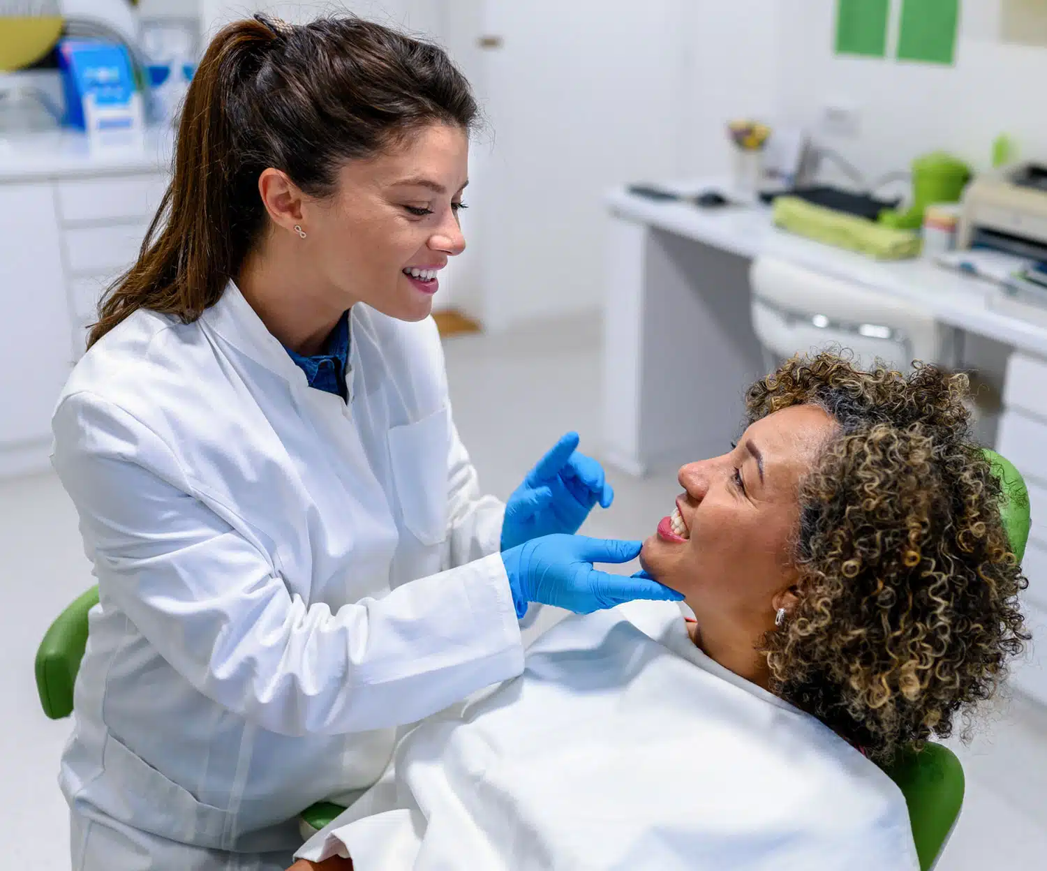 Dentist looking at patient teeth
