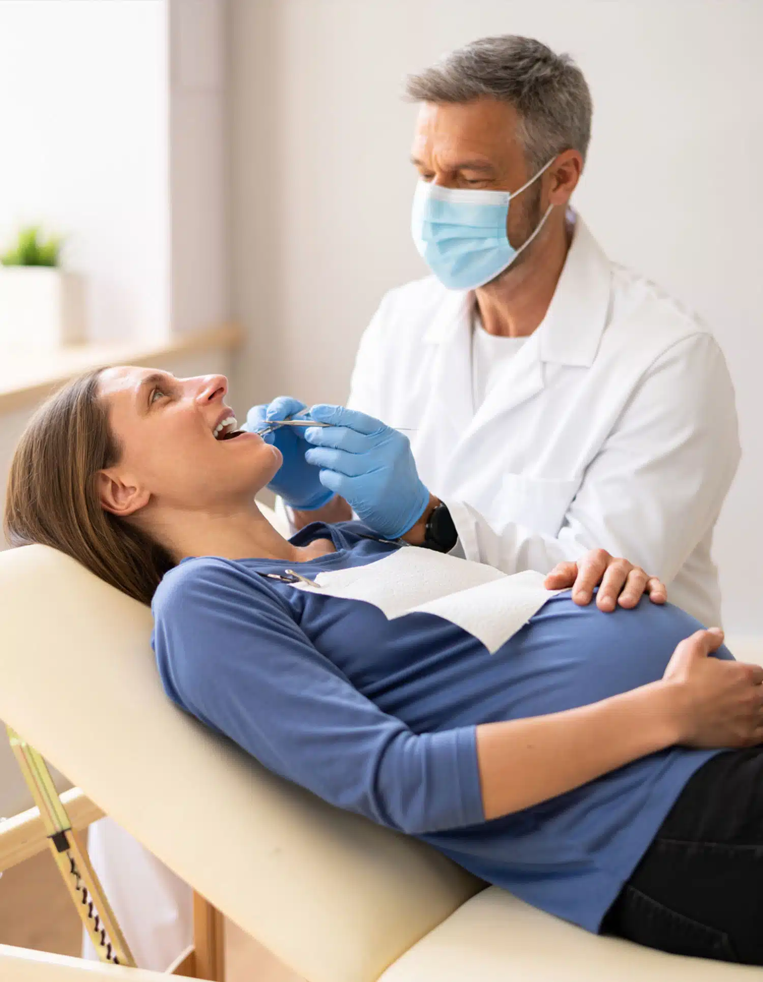 Male dentist doing a procedure in a female patient