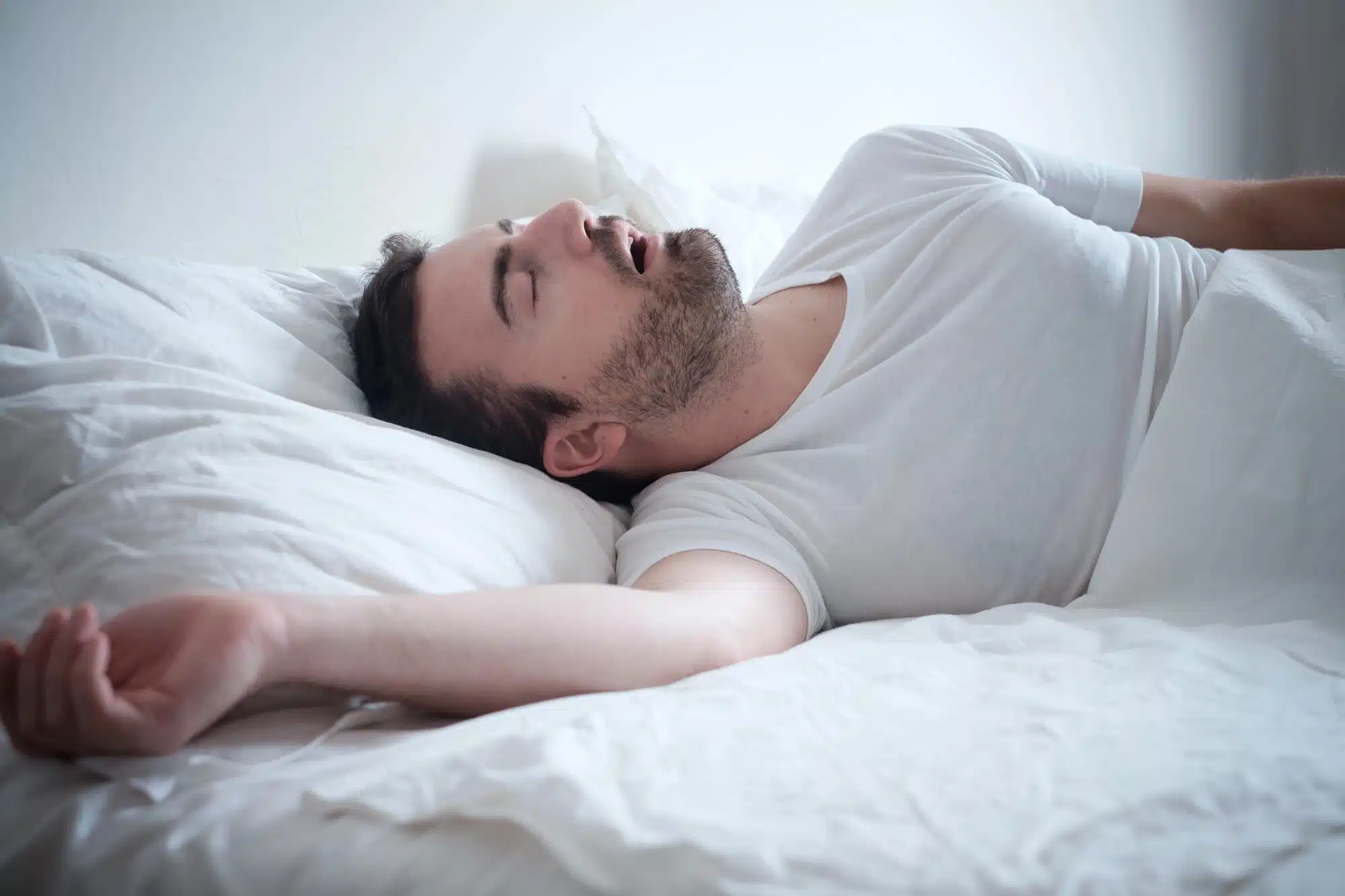 man snoring due to sleep Apnea in Novi