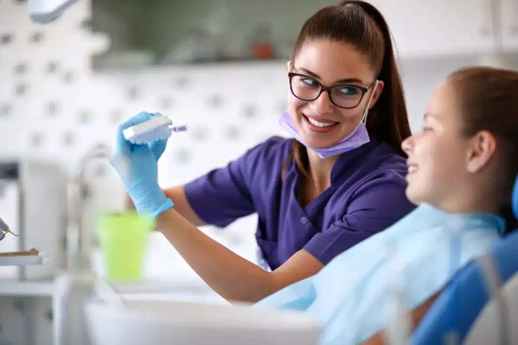 Novi-endodontics-dentist-showing-a-dental-model-to-patient