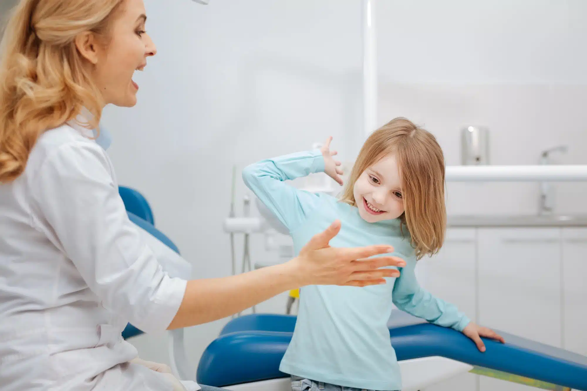 girl giving her emergency dentist in Novi, MI a high five