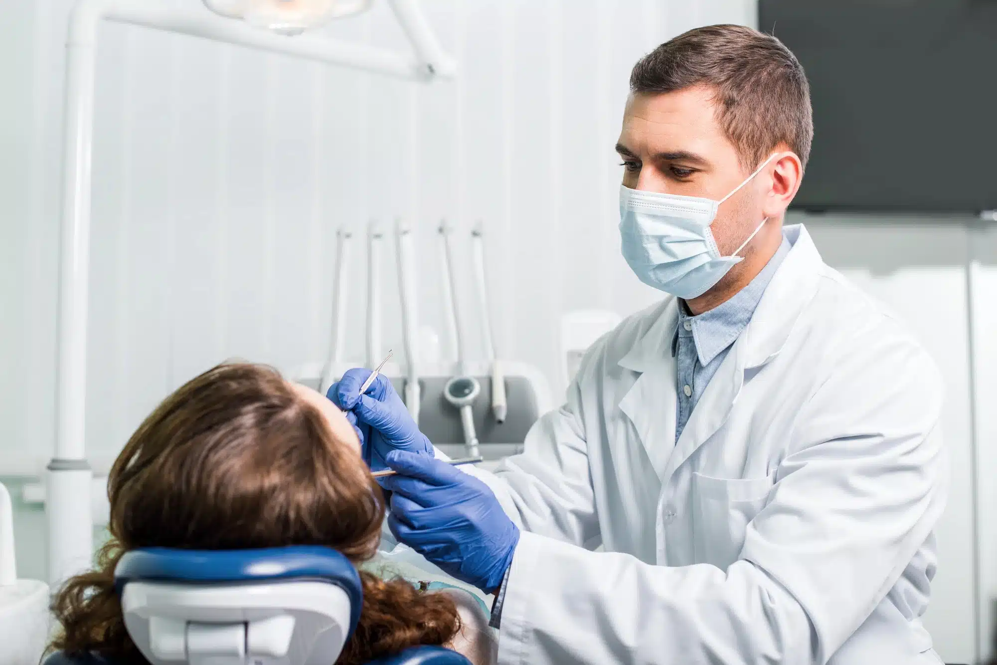 Novi dentist tending to patient