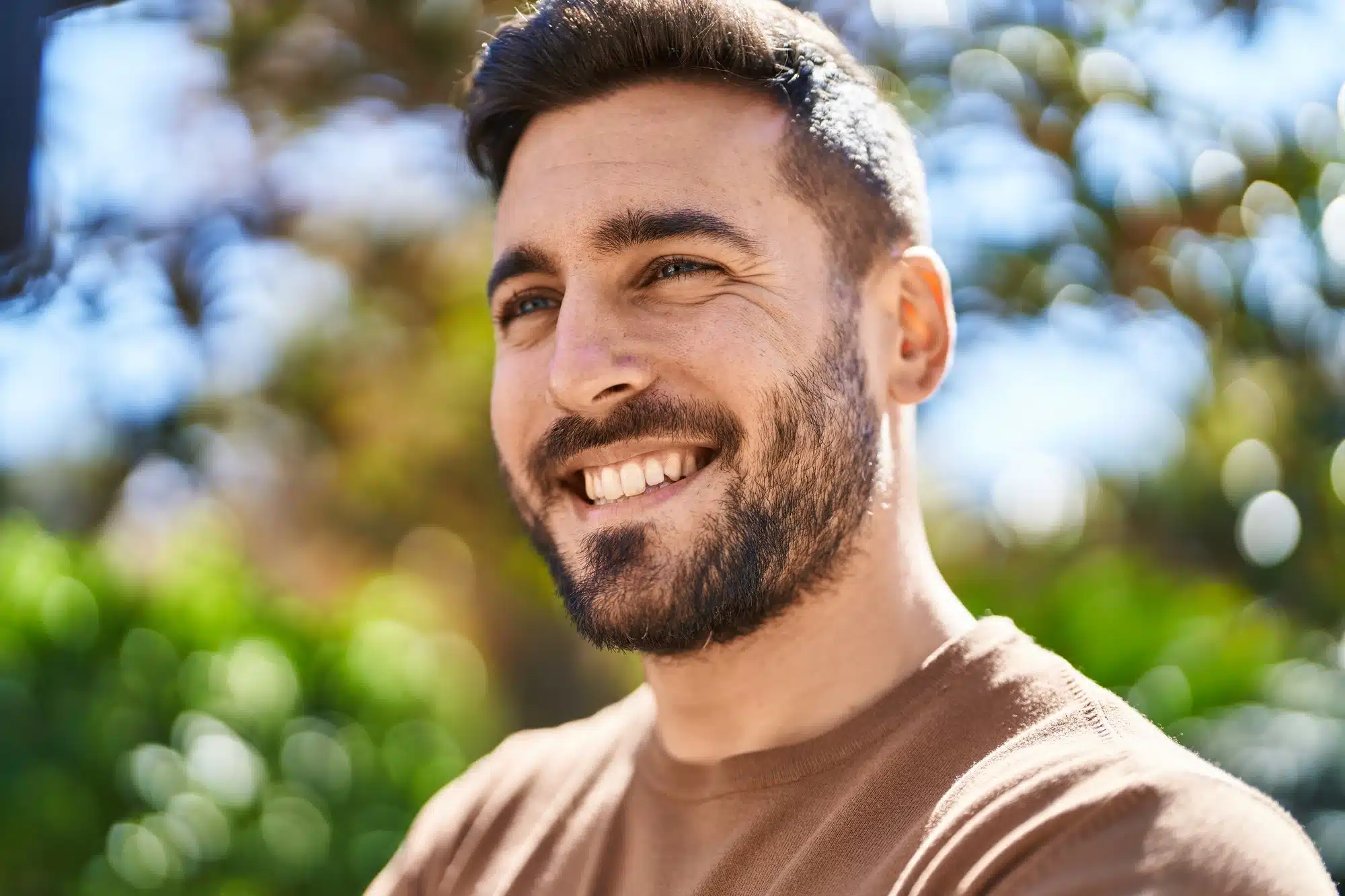 happy man after getting porcelain veneers in Novi, MI